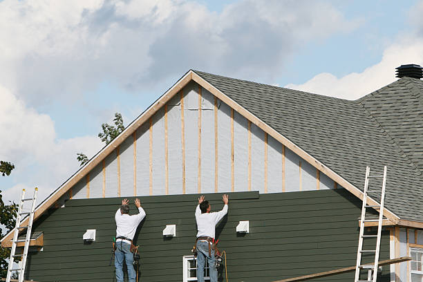 Professional Siding technician working in Northfield, IL